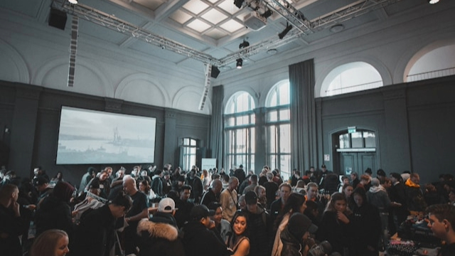 event attendees in a meeting room